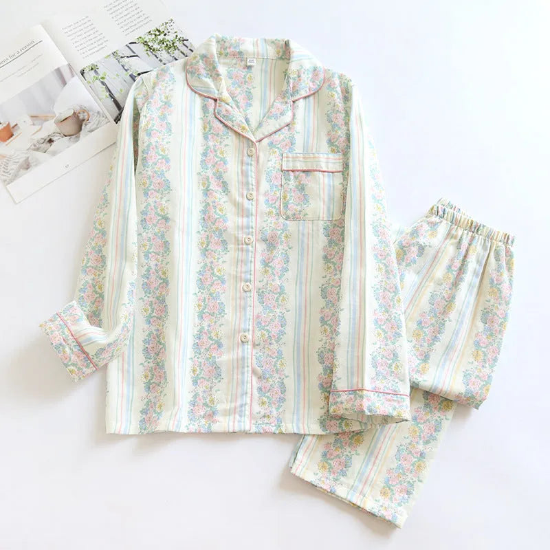 Ladies' long-sleeved cotton gauze homewear set in a striped floral print, showing top and trousers laid flat.