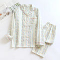 Ladies' long-sleeved cotton gauze homewear set in a striped floral print, showing top and trousers laid flat.