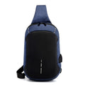 Small square dark blue Oxford cloth chest bag with a single strap and zipper, shown worn across the chest.