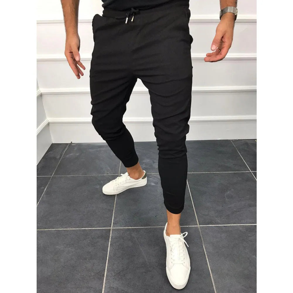 Lace-up casual jogging pants in solid light grey, nine points length, mid-waist, with adjustable front laces