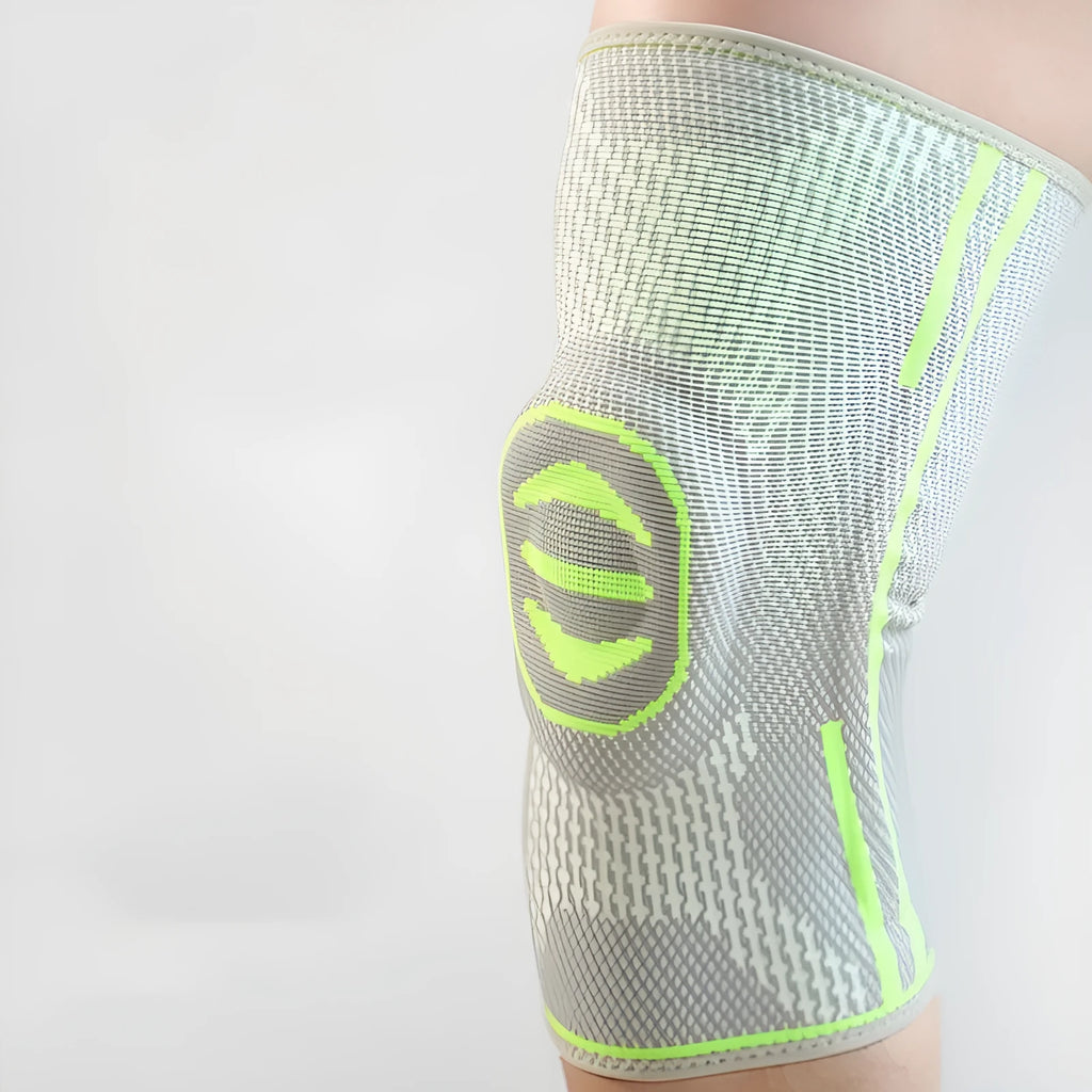 Cotton mountaineering knee cover in green, shown on a knee, with blue and yellow options available.