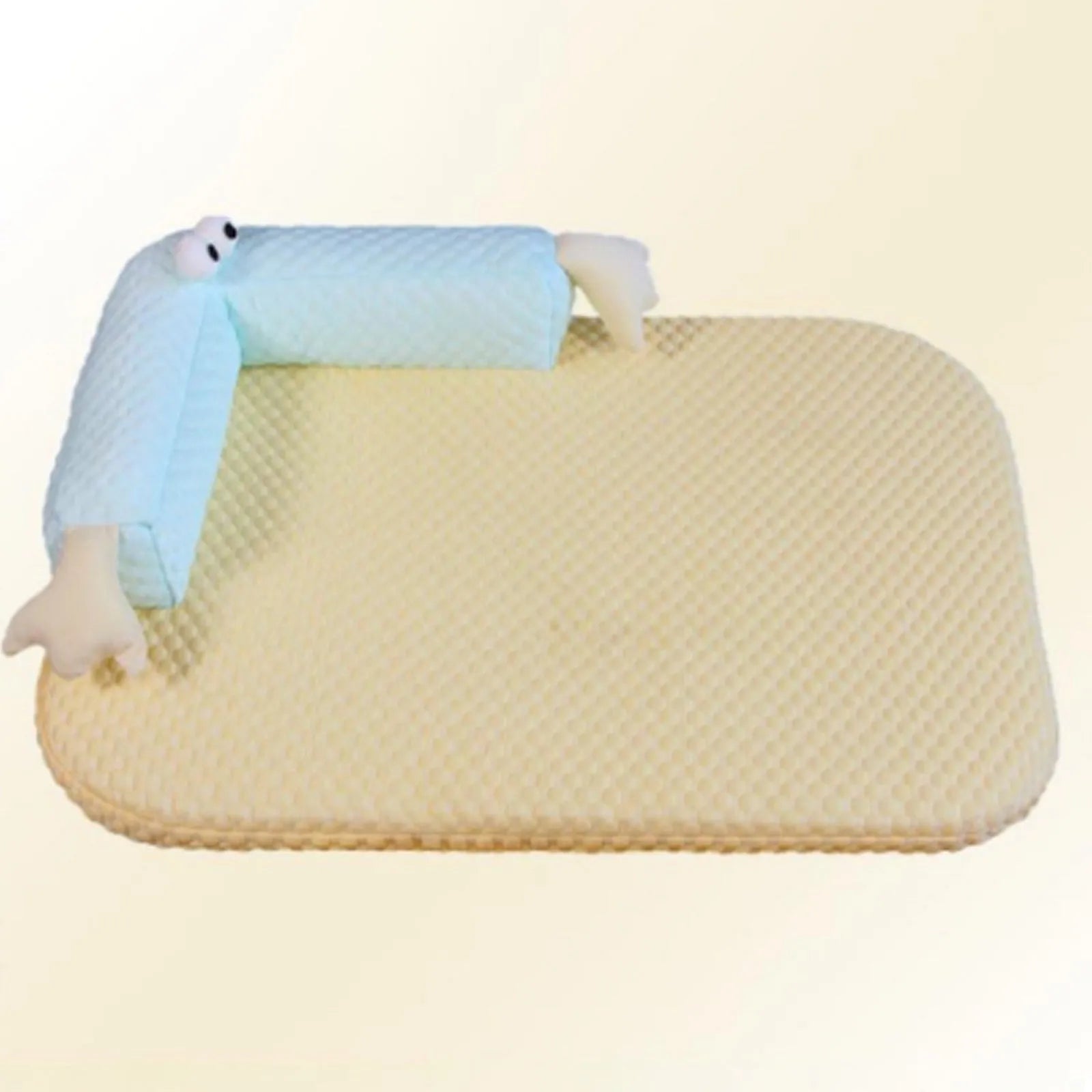 Blue pet bed with big-eyed monster design on a wooden floor next to a cat.