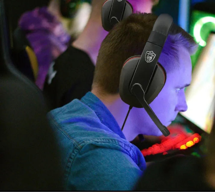 Black wired gaming headset with over-ear cups and a straight 6.3mm audio plug on a 1.2m cable.