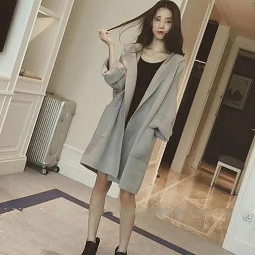 Plus size woman modelling a loose grey lace-trim thin cotton coat for spring and autumn.