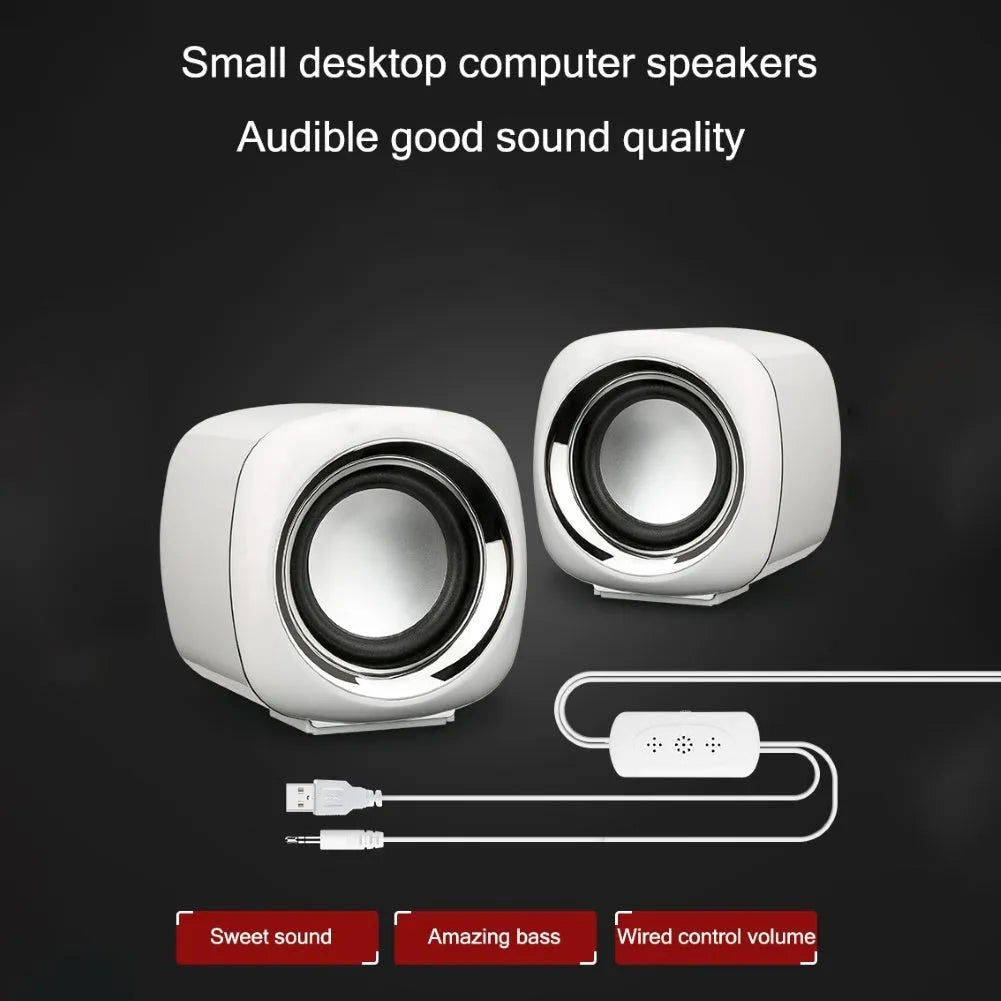Compact black desktop speakers with 3.5mm cable and volume scroll wheel