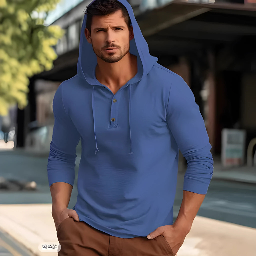 Cotton pullover sports hoodie in apricot colour on a hanger.