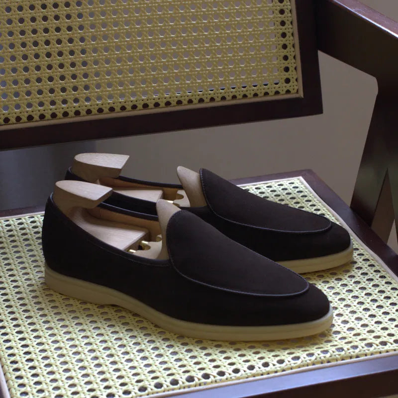British handmade brown leather loafers for men on a white background