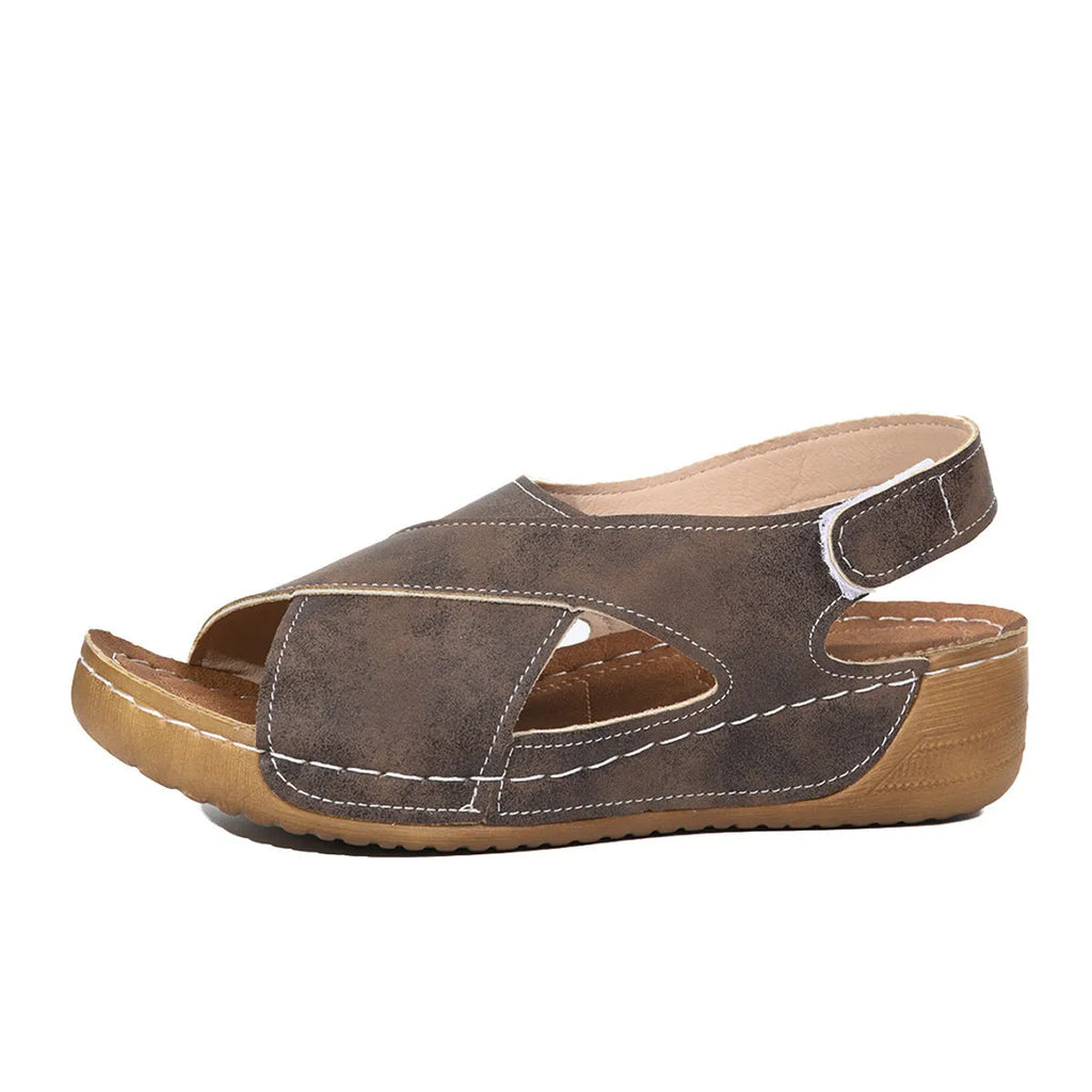 Roman platform sandals with a skirt detail and open toe design on a rubber sole