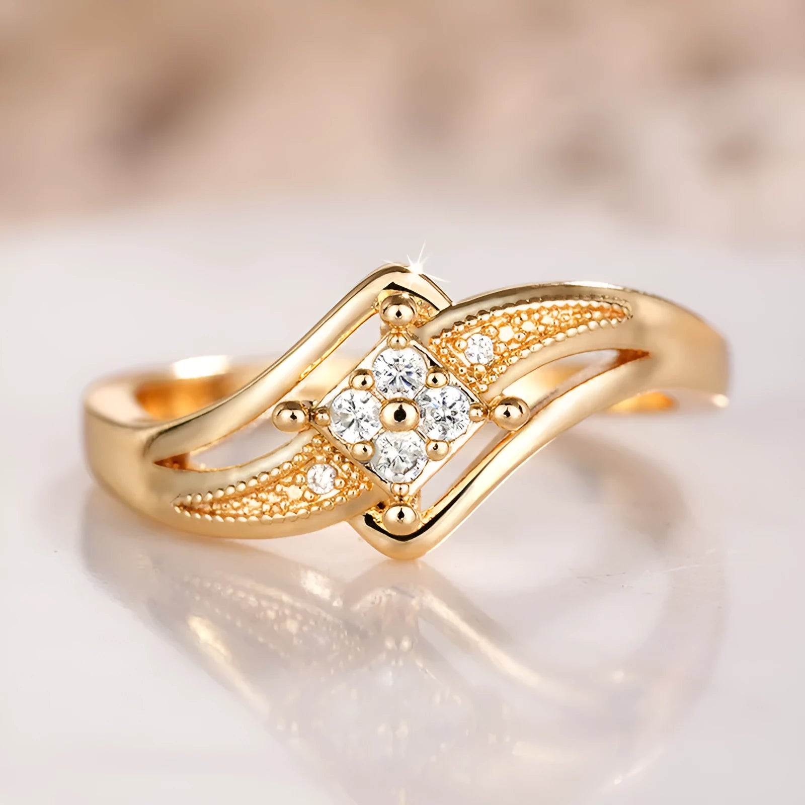 Yellow gold coloured copper diamond ring with micro inlaid zircon detail and geometric quadrangle design.
