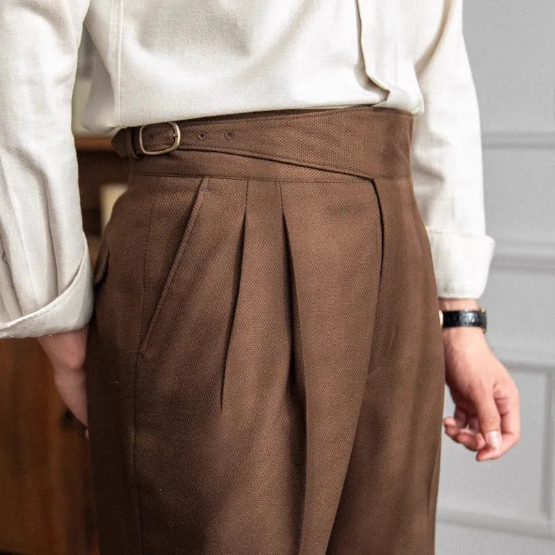 Man wearing high waist straight leg casual trousers in black polyester fabric.