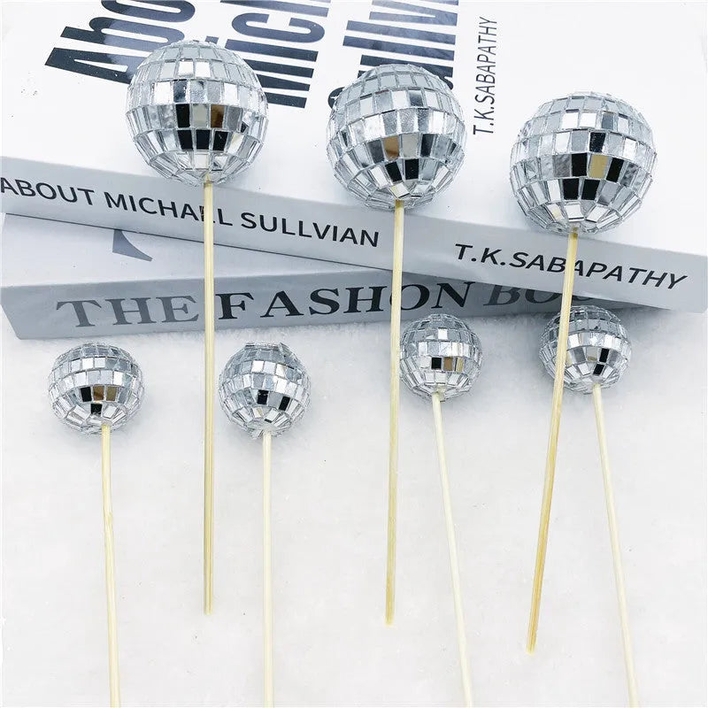 Glass disco ball cake decoration on wooden stick available in four sizes from 2.5cm to 5cm diameter