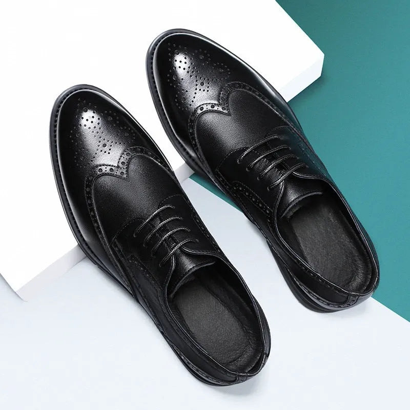 Men's black and brown brogue leather shoes with decorative perforations, shown on a white background.