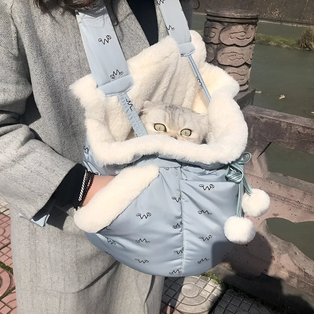 Winter pet carrier backpack in blue and pink made of soft flannel for cats and dogs