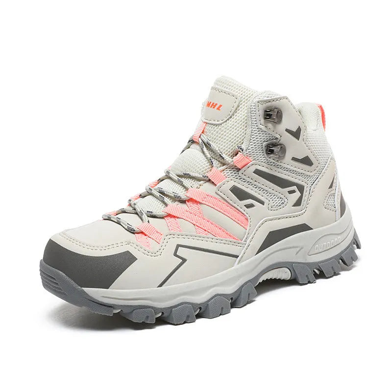 A pair of low-top hiking sneakers with a flannel upper and rubber sole, shown on a rocky mountain path.