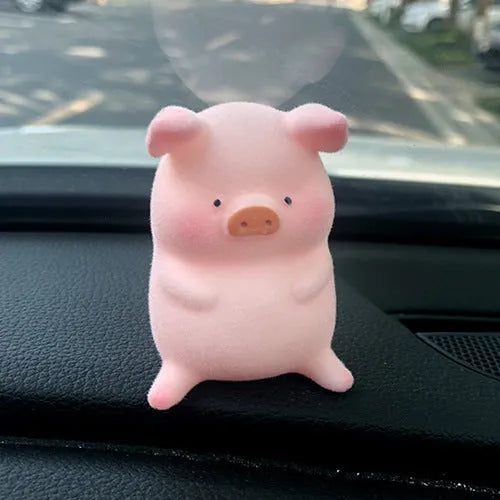 Cartoon pig character resin car ornament for dashboard or windscreen decoration.
