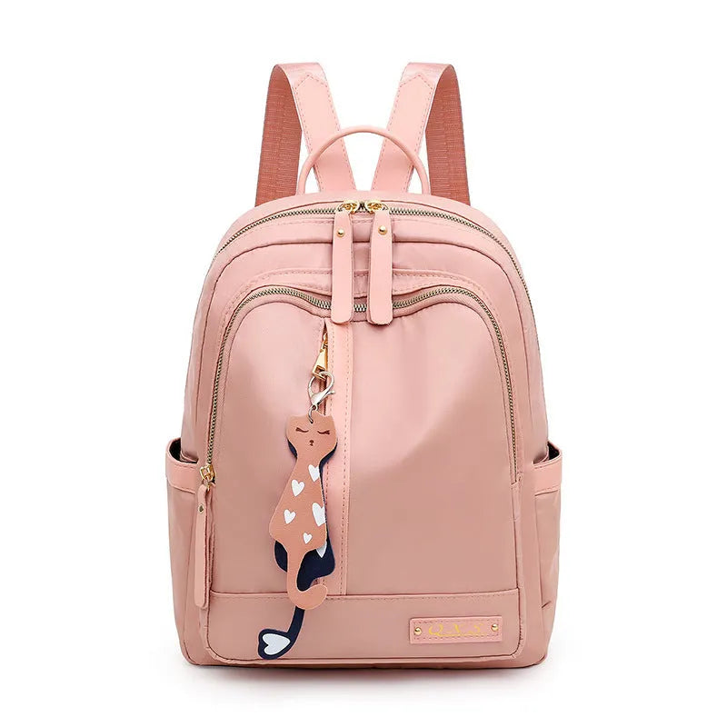 Women's black nylon backpack with square vertical shape showing internal compartments and shoulder straps