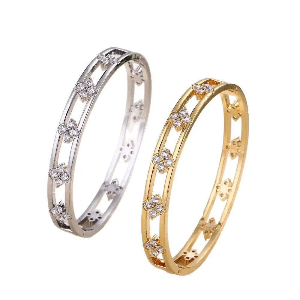 Women's hollow bracelet with four-leaf clover design and zircon stones in gold or silver finish