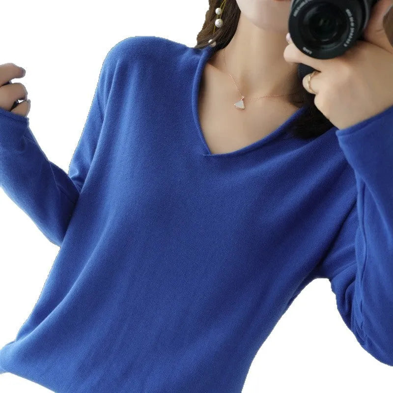 Women's V-neck long sleeve knitwear pullover top in a non-ironing material on a hanger.