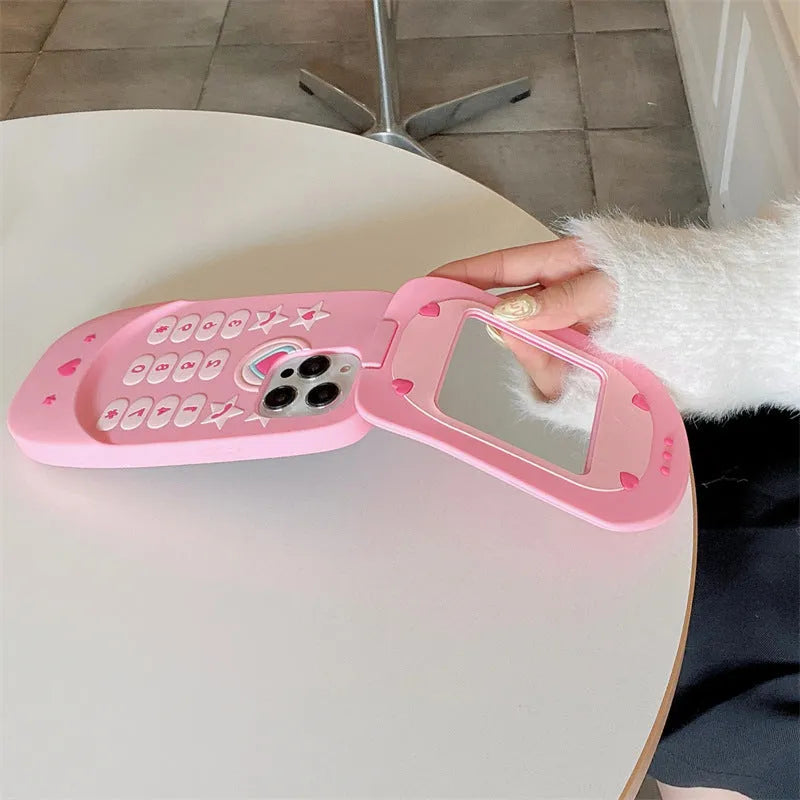 Light pink silicone flip phone shape mirror case for iPhone showing built-in mirror and nostalgic design