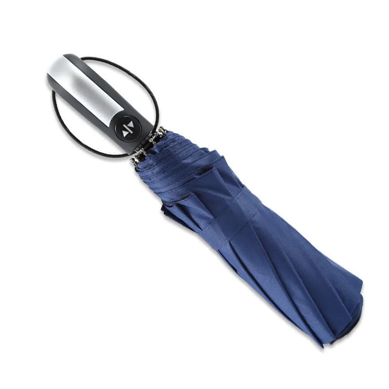 Black automatic open triple folding business umbrella with 10 ribs, shown in open position.
