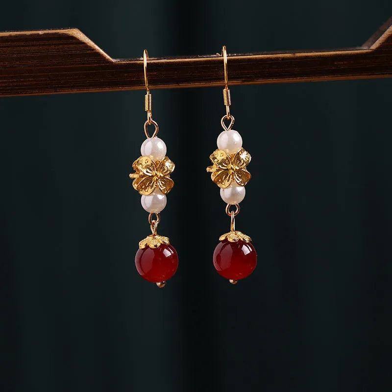A pair of geometric-shaped vintage court style alloy earrings with an electroplated finish for women.