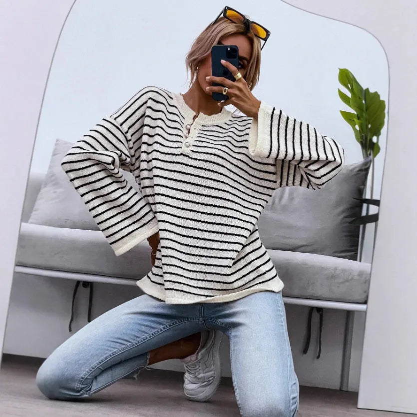 Black women's striped long sleeve top with drop-shoulder sleeves and contrast colour details