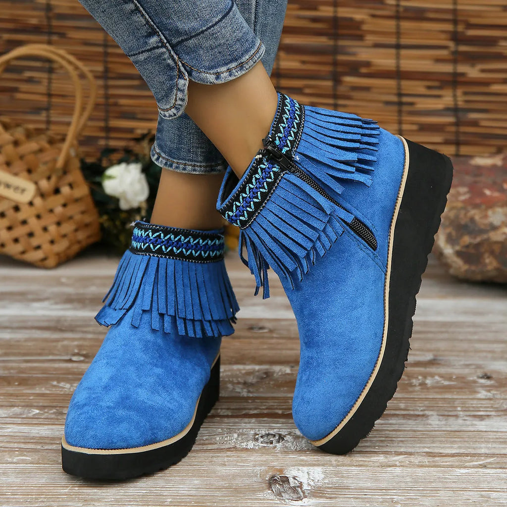 Women's black suede wedge ankle boots with side zipper and decorative tassel on a thick rubber sole.