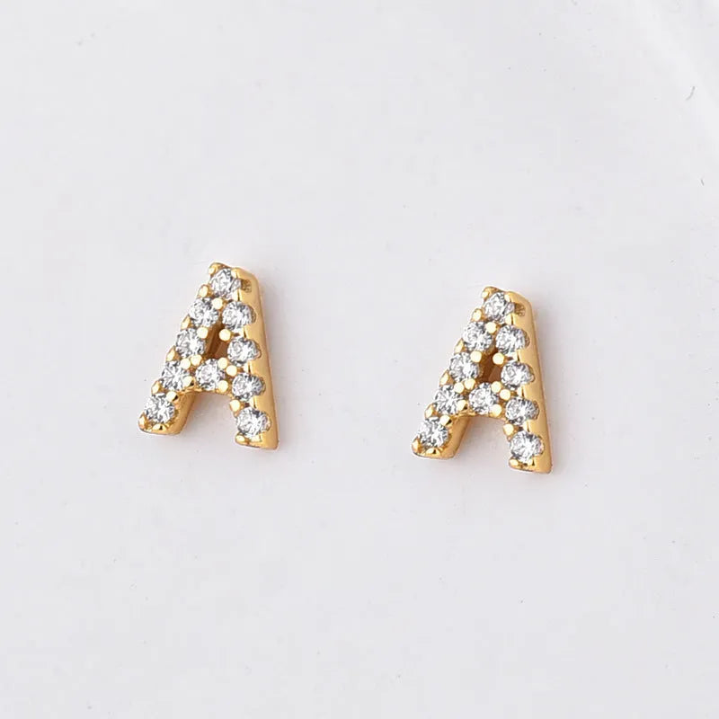 Brass gold plated alphabet letter earrings showing single English letter design with zircon stones