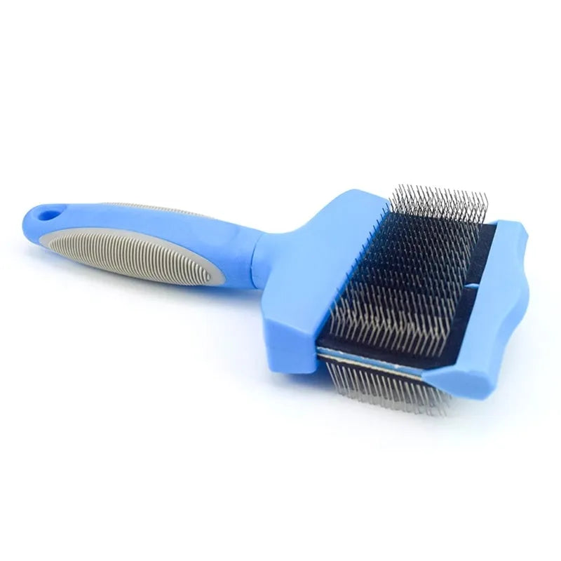 Blue double-sided pet brush with ergonomic handle shown next to pink version, displaying soft and firm stainless steel pin sides.