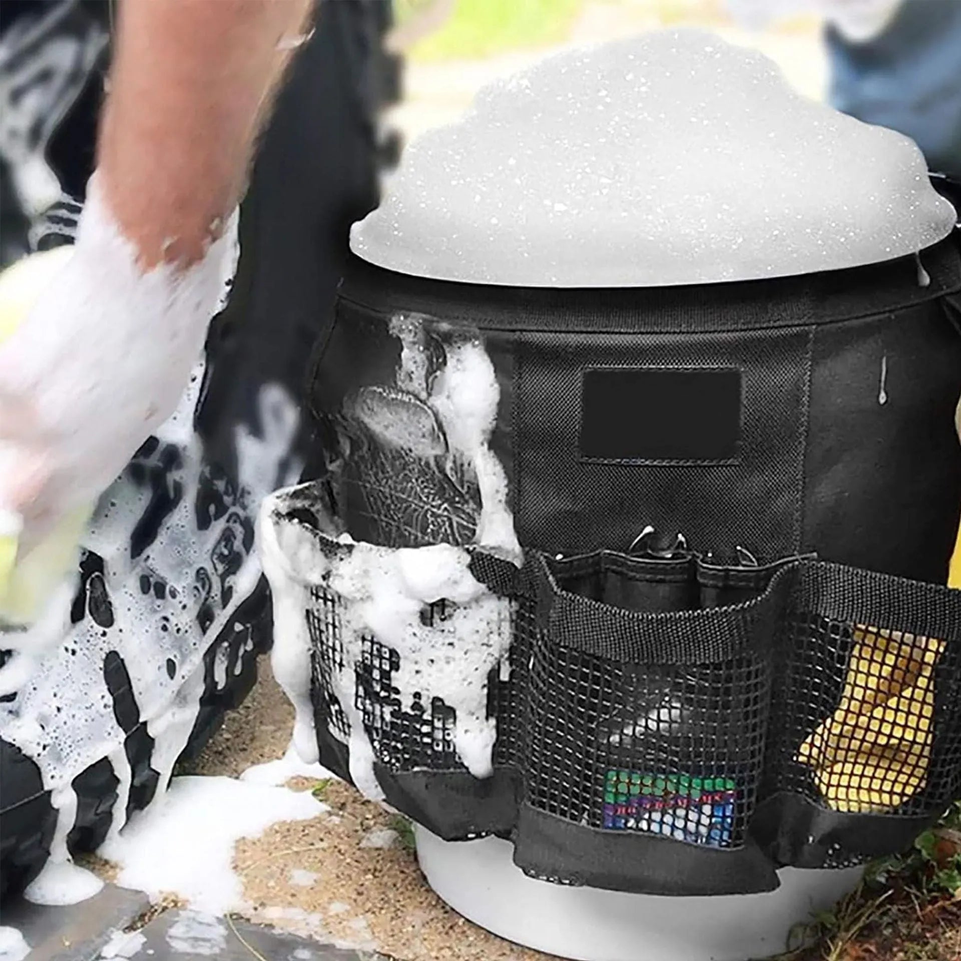Black polyester hanging storage bag designed for a 5-gallon barrel, showing cylindrical shape.