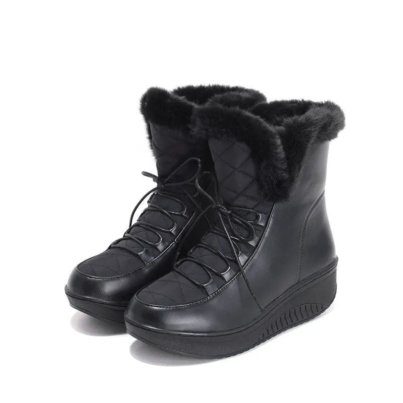 Black women's lace-up winter boots with platform sole on a white background