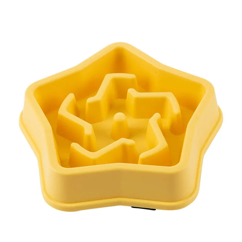 Yellow plastic dog slow feeder bowl with textured bottom and interior feeding obstacles