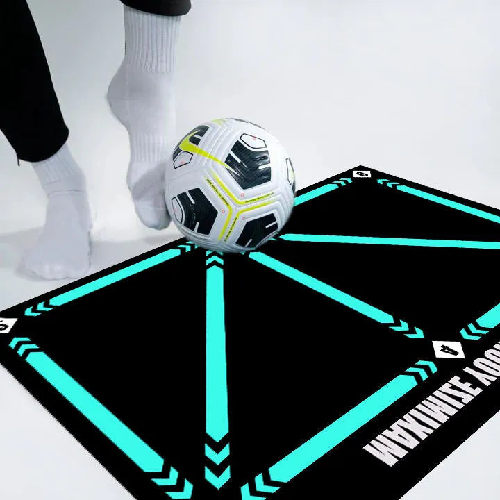 Black rectangular football training mat on floor for ball control practice drills