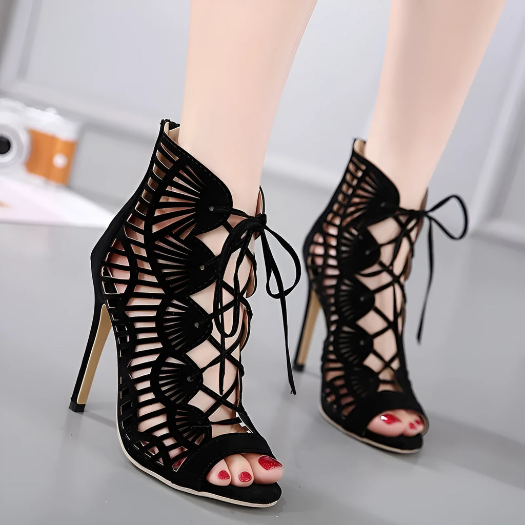 Black lace high heels with suede upper, fish mouth toe, stiletto heel above 8cm, and hollow design.