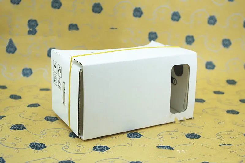 Pink cardboard VR glasses with 3D lenses and adjustable rubber band head strap for smartphones