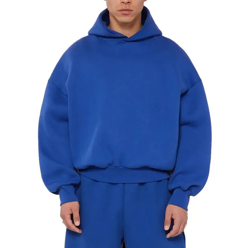 Men's grey fleece-lined pullover hoodie with wool lining shown in casual wear