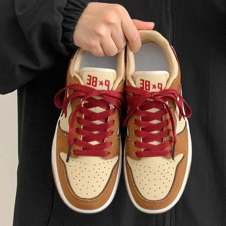 Brown women's platform sneakers with sequin details and a lace-up front.