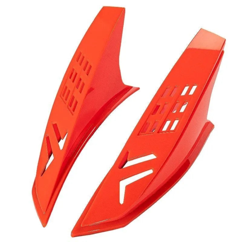 A pair of coloured helmet horns for child's motorcycle or ski helmet modification.