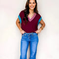 Burgundy women's V-neck loose fit sweater with contrast trim and cuffed short sleeves