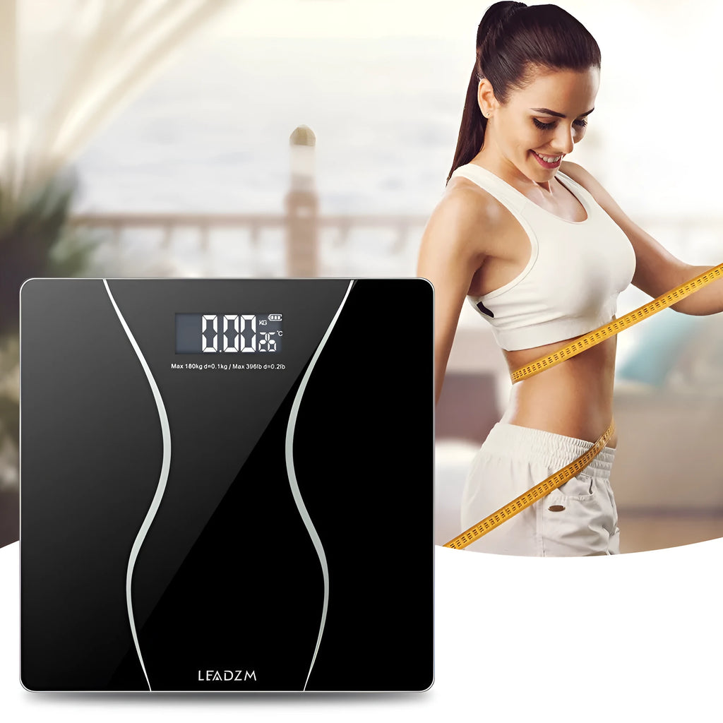 Black electronic household body scale with tempered glass platform and digital display