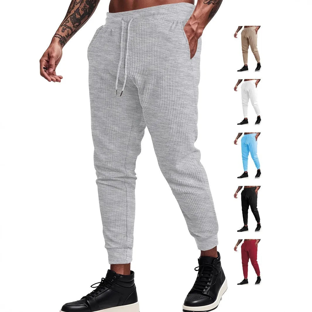 Men's casual loose solid colour drawstring pants in waffle knit polyester, front view