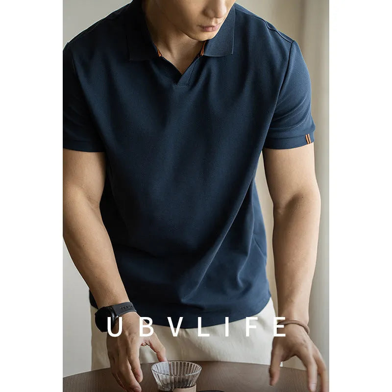 American-style short-sleeved polo shirt in a blue cotton-polyester blend on a hanger.