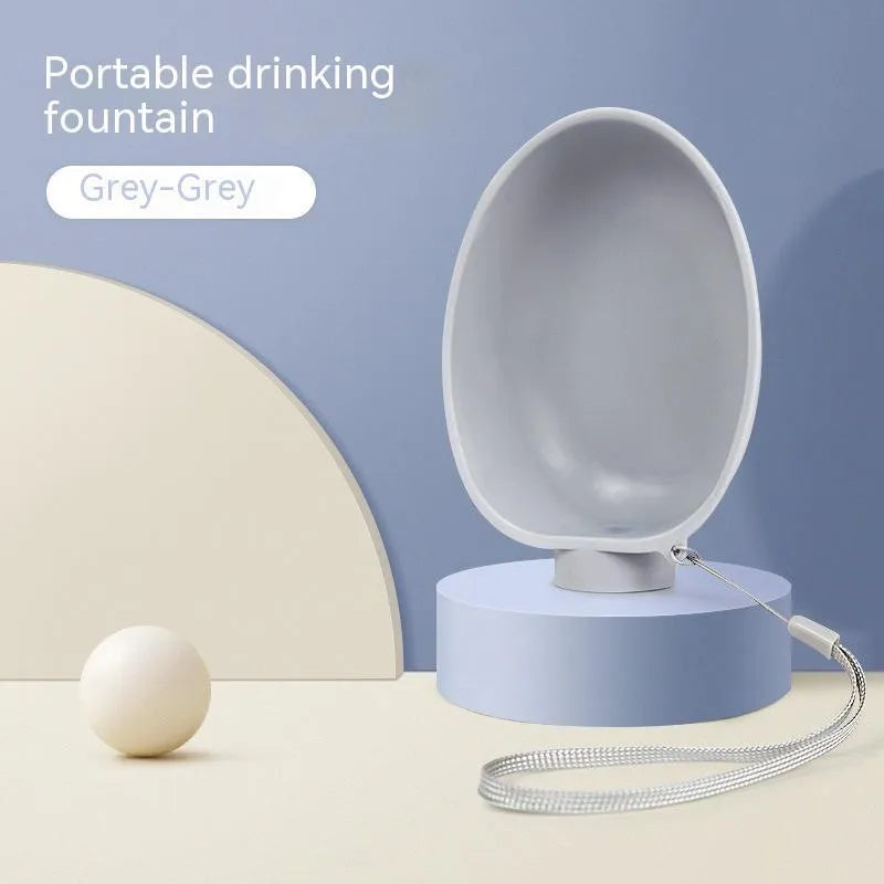 Portable dog drinking bowl in blue, 125x95x40mm, ABS material, slow-flow valve for outdoor dog feeding
