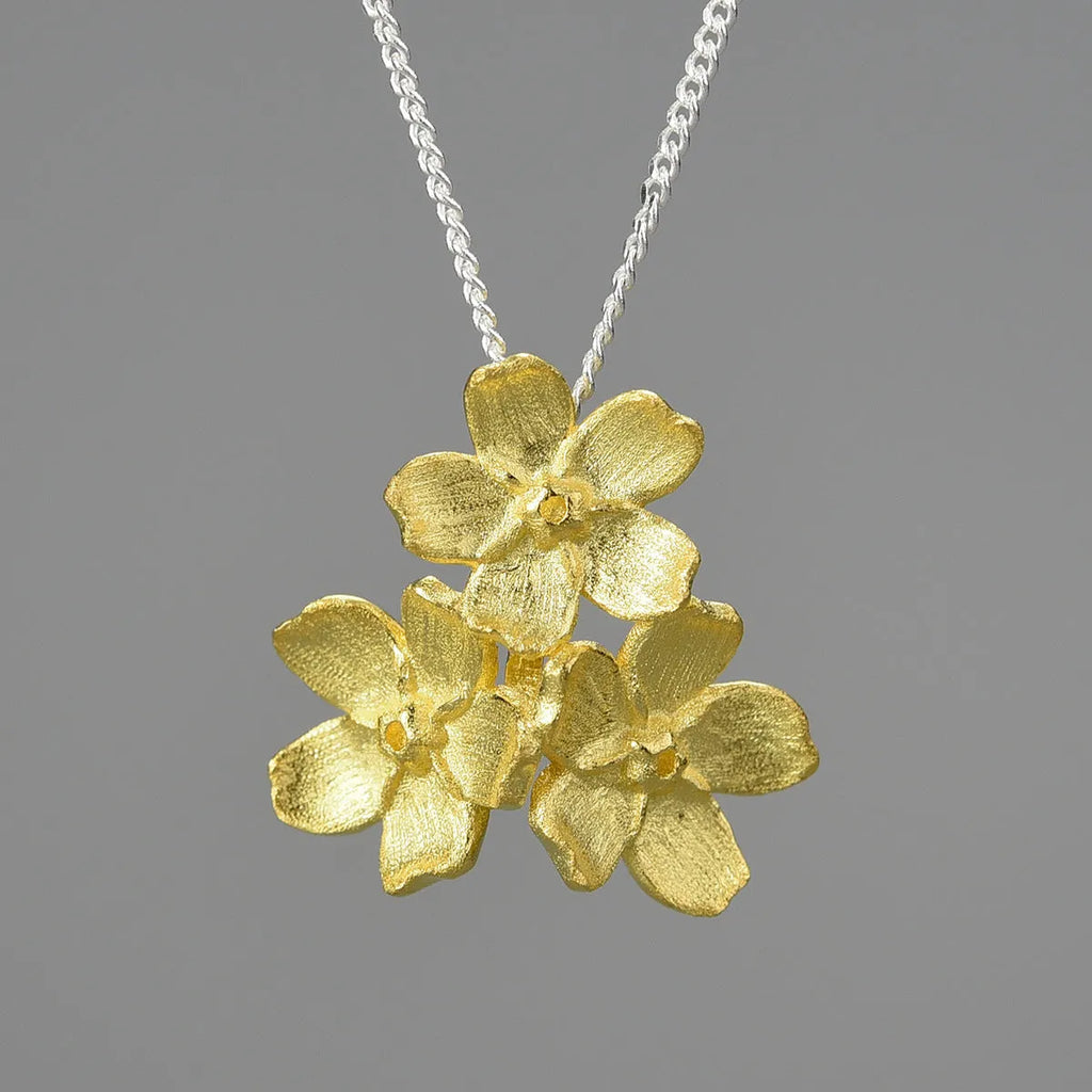 Sterling silver forget-me-not flower pendant with electroplated gold or silver finish