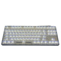 Full set of 132 transparent plastic key caps for mechanical keyboards laid out.
