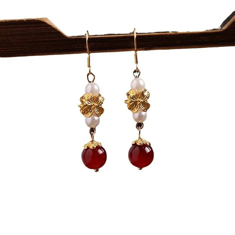 A pair of geometric-shaped vintage court style alloy earrings with an electroplated finish for women.