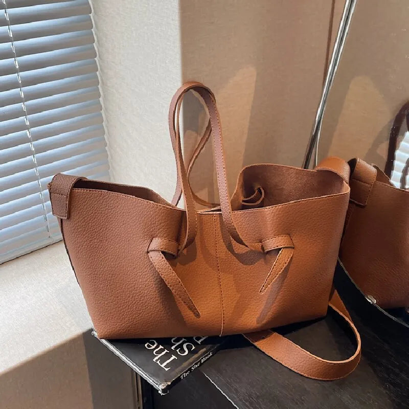 Large capacity one-shoulder crossbody bag in soft PU with sewing line detail, available in black, brown, coffee, gray