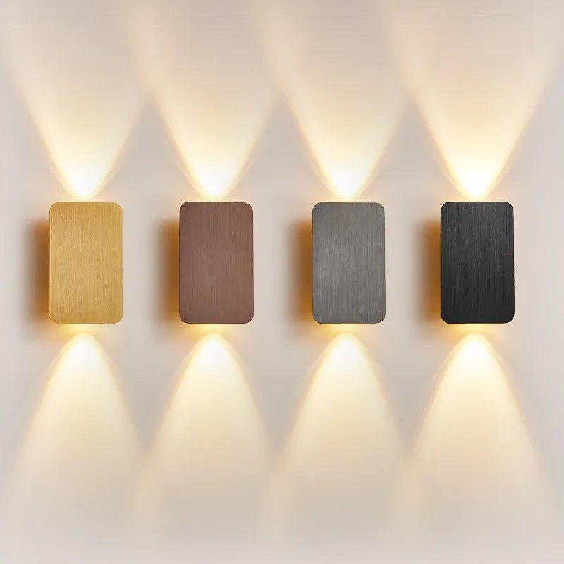 Modern Nordic minimalist LED wall lamp mounted beside bed showing black finish and warm light illumination