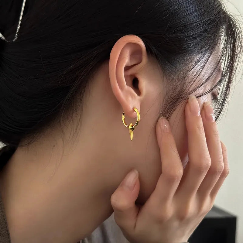 Women's geometric star-shaped ear clip earrings with a copper white gold electroplated finish.
