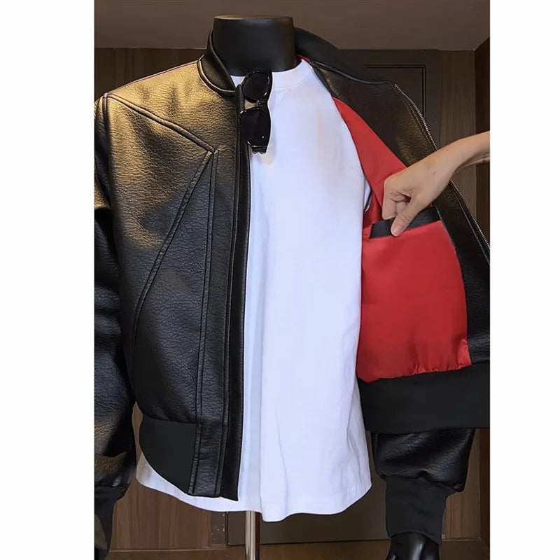 Men's black PU leather jacket with litchi pattern texture and extended length, shown in slim-fit light business style